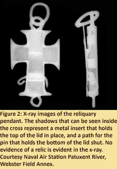 Figure 2: X-ray images of the reliquary pendant.  The shadows that can be seen inside the cross on the x-ray represent a metal insert that holds the top of the lid in place, and a path for the pin that holds the bottom of the lid shut.  No evidence of a relic is evident in the x-ray.  Courtesy Naval Air Station Patuxent River, Webster Field Annex.