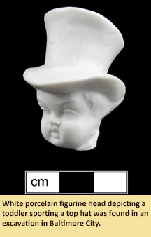 white porcelain figurine head depicting a toddler sporting a top hat was found in an excavation in Baltimore City.