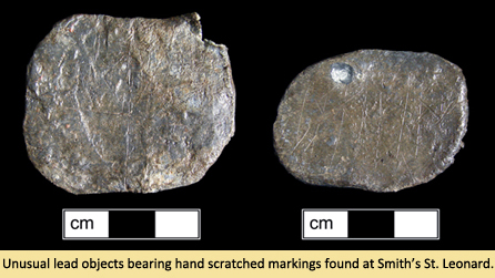Unusual lead objects bearing hand scratches from Smith St. Leonard Site.