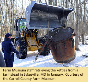 Farm Museum staff retrieving the kettles from a farmstead in Sykesville, MD in January. 