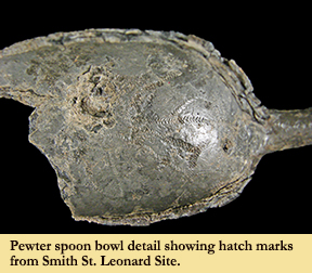 A pewter spoon found at Smith's St. Leonard Site with hatch marks visible on inside of spoon bowl.
